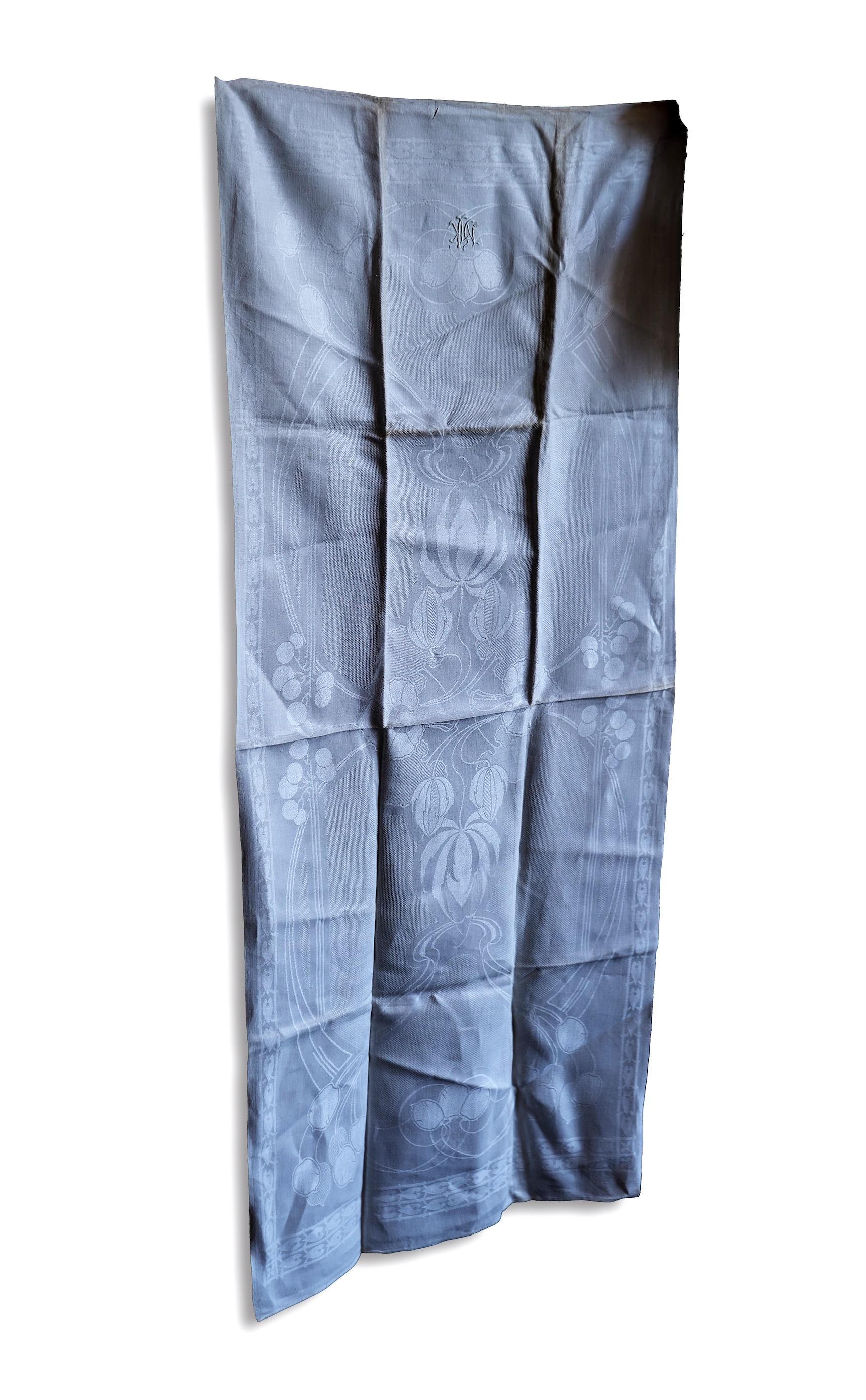 A set of four large Art Nouveau, unused white damask woven hand towels. The pattern having strong Archibald Knox and Walter Crane design elements; with trailing Honesty seeds and Tulip flower heads, these motifs much use